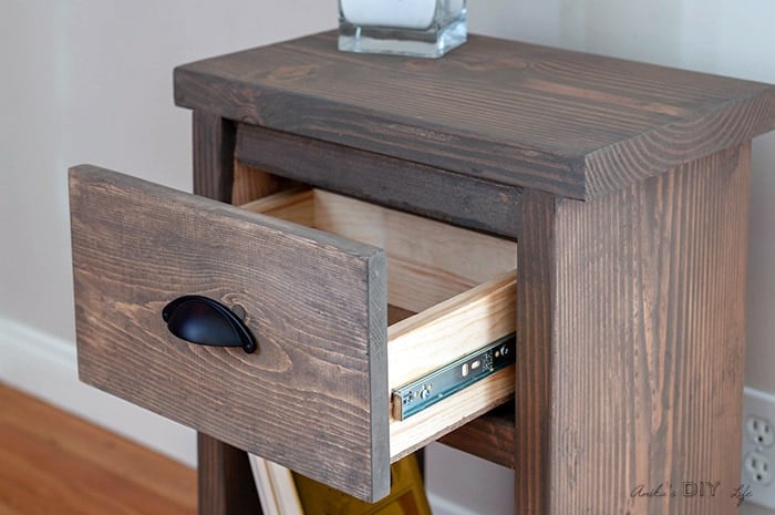 Open drawer in DIY nightstand with hidden storage