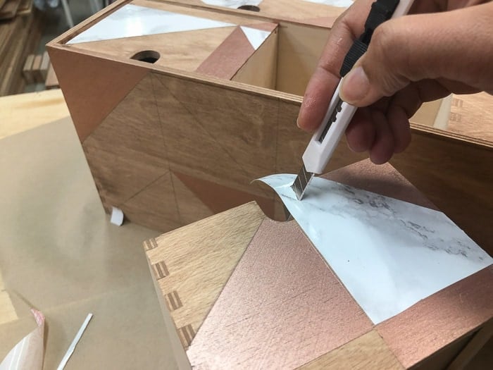 Adding marble contact paper to the Ikea Moppe drawers for a makeover