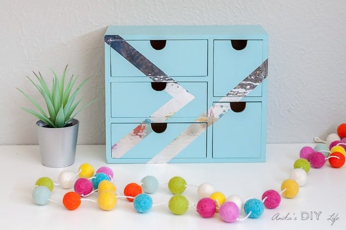 Ikea Moppe Alternative painted with tape on table with pom poms