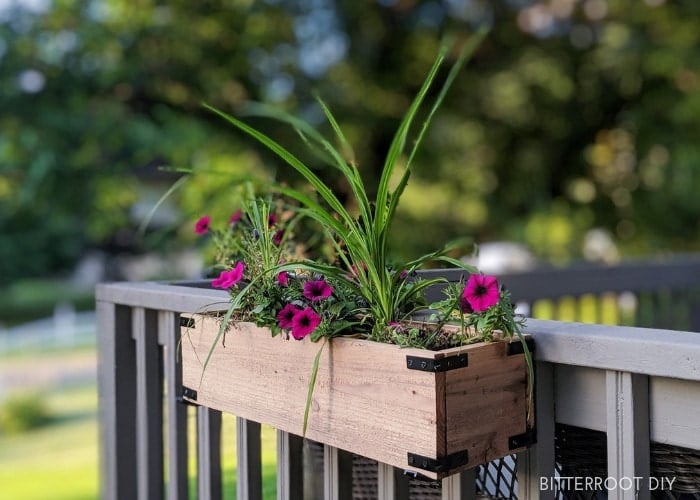 wood planter box attached to deck rail