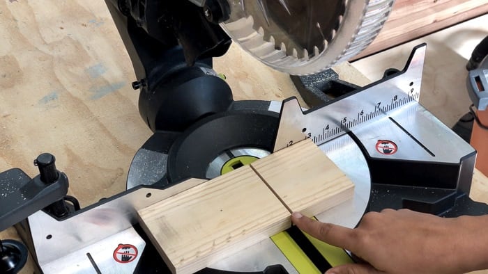 A piece of lumber cut with gap showing the kerf of a blade.