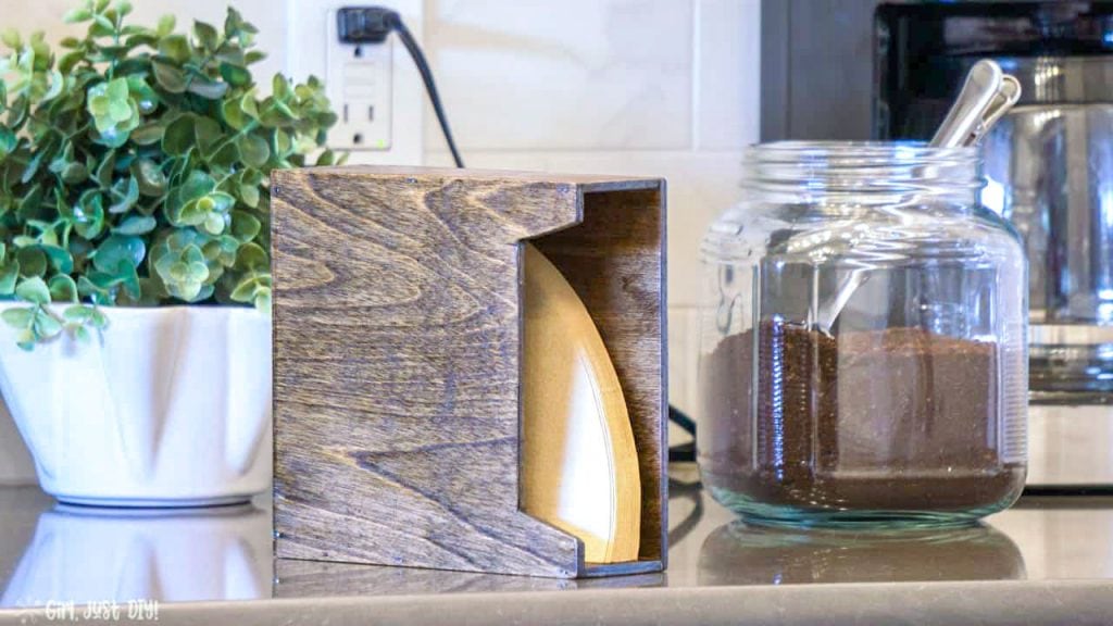 Coffee Filter Holder standing on counter next to coffee canister.