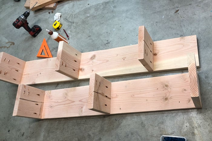 Two sides of the bookshelf built with shelves attached.