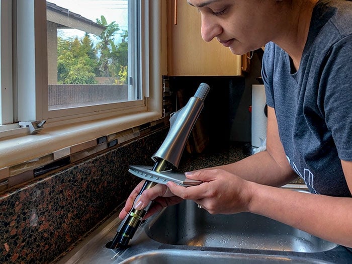 Dropping new faucet into the sink