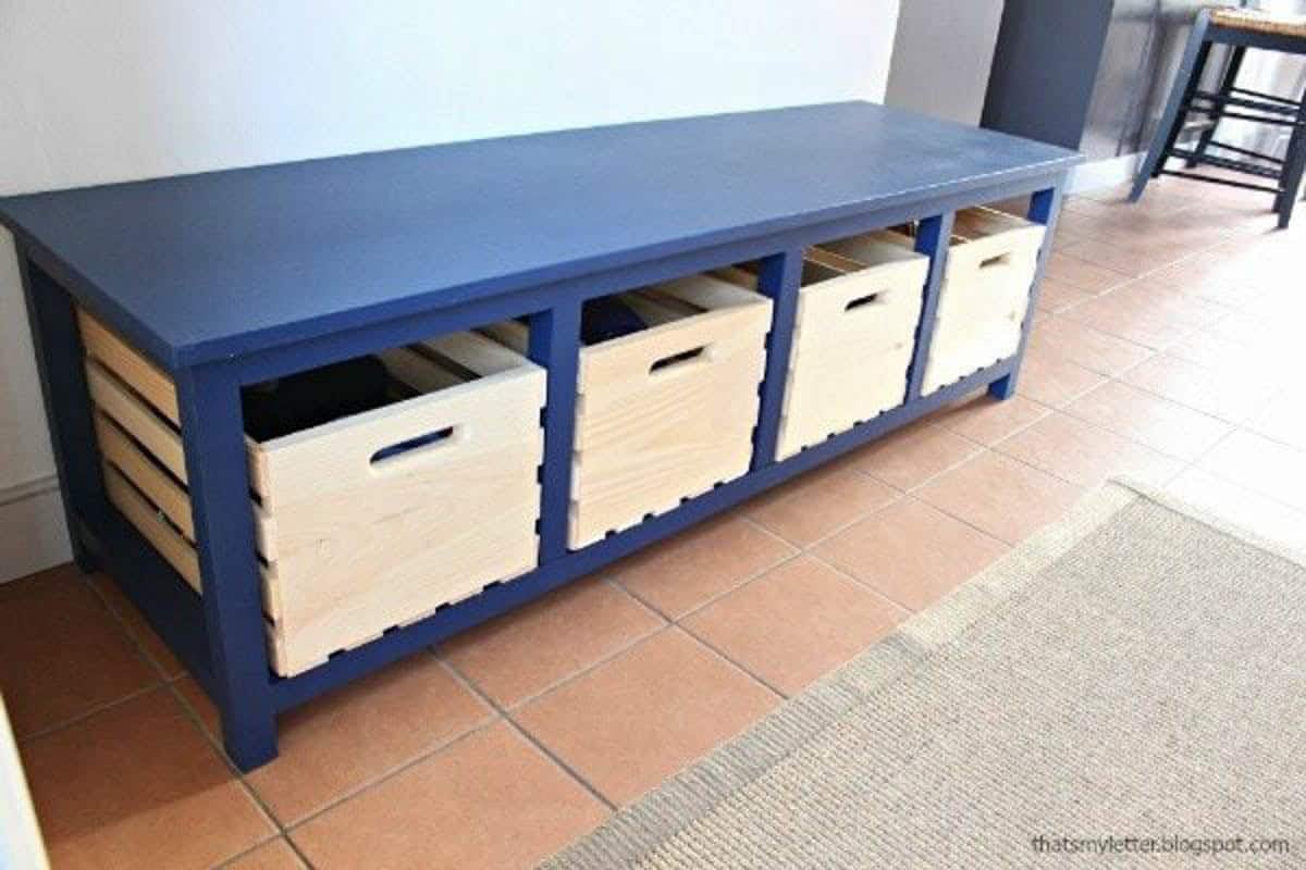 Blue painted bench with cubby storage with 4 bins