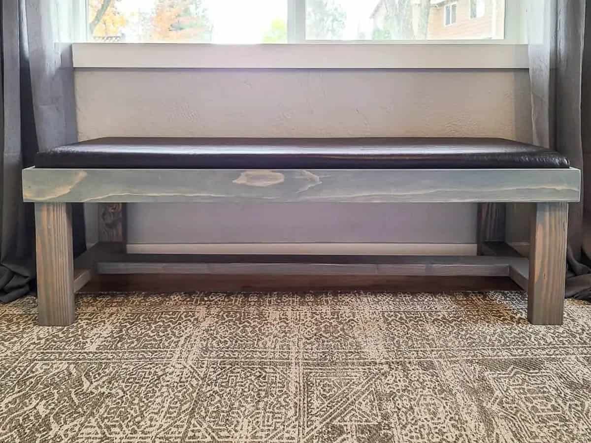 DIY bench with cushion under a window