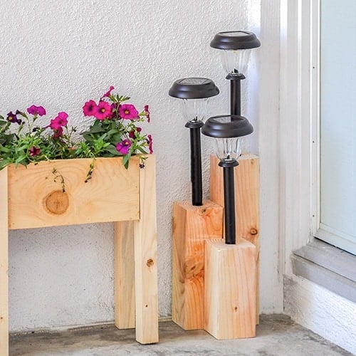 Learn how to make an inexpensive DIY solar light post to decorate your front yard or backyard. This quick project uses a board of 4x4 and a solar lamps. Make it as large or small as you like!