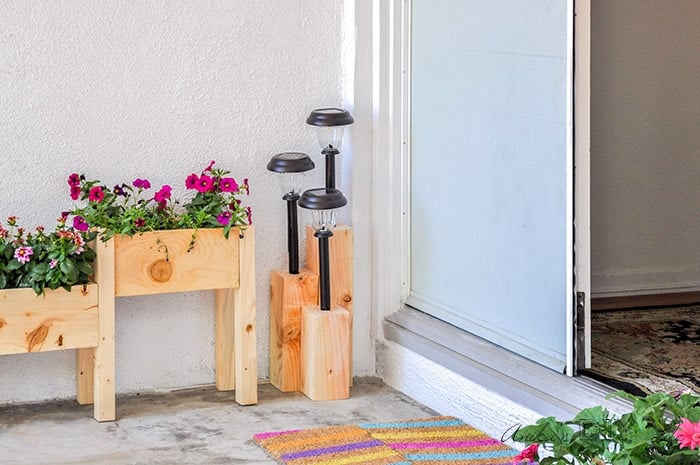 Front porch with DIY solar light stand and planter
