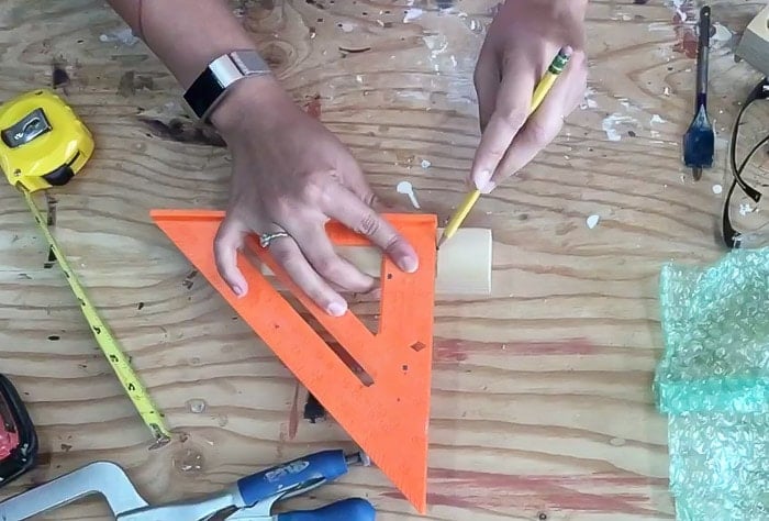 Measuring 2x2 scrap to make a cube for the test tube bud vase