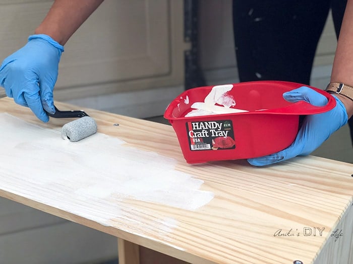 Applying primer to Ikea Rast with roller and a Handy craft tray