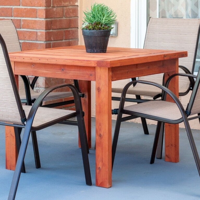 Learn how to make a simple DIY outdoor dining table with full plans, tutorial, and video. This DIY Outdoor table uses only structural 2x4 and 2x6 lumber and costs $20!