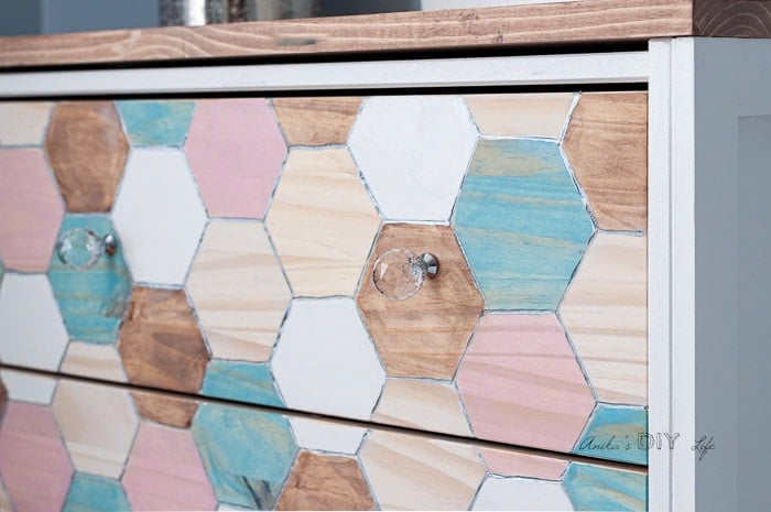 Close up of engraved Ikea Rast drawer with hexagon design