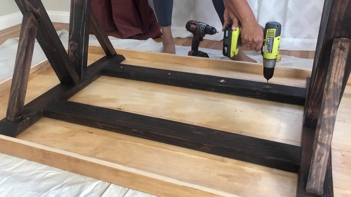 Attaching the legs to the table top using wood screws