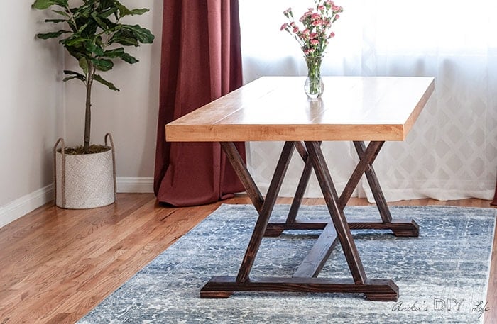 DIY W-Trestle Dining table in dining roomHow to build an Easy DIY trestle dining table! This is a great farmhouse project for anyone! #AnikasDIYLife