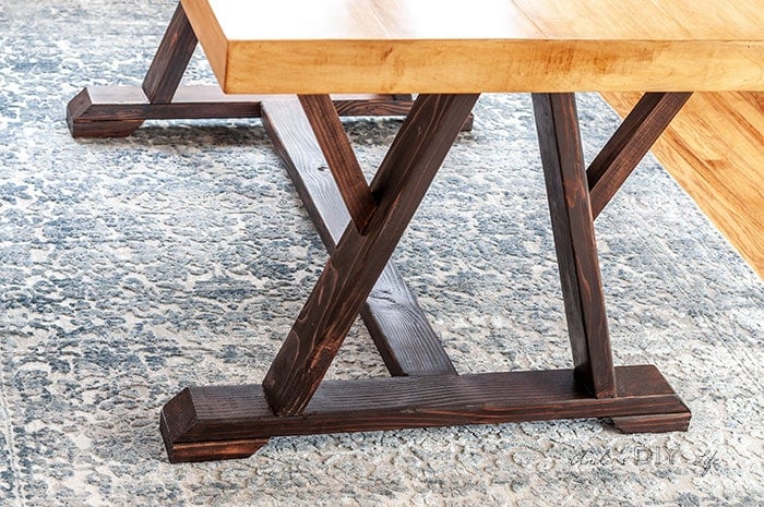 Close up of legs and top of the trestle dining table project