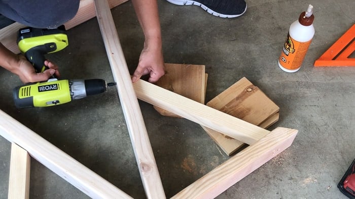 Attaching the 2x2 braces to the A-frame for the DIY trestle dining table