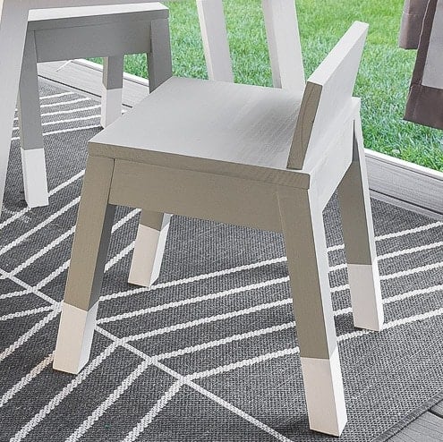 Learn how to build a simple modern angled leg DIY kids chair. The complete woodworking plans show you how to build this easy woodworking project for your toddler.