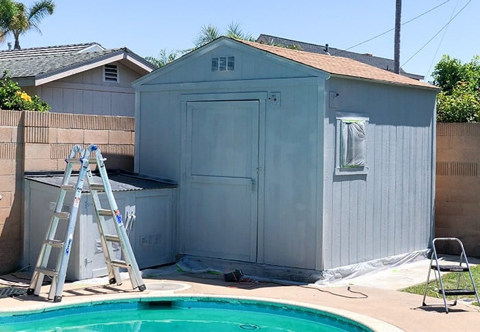 Outdoor Garden shed covered in grey primer.