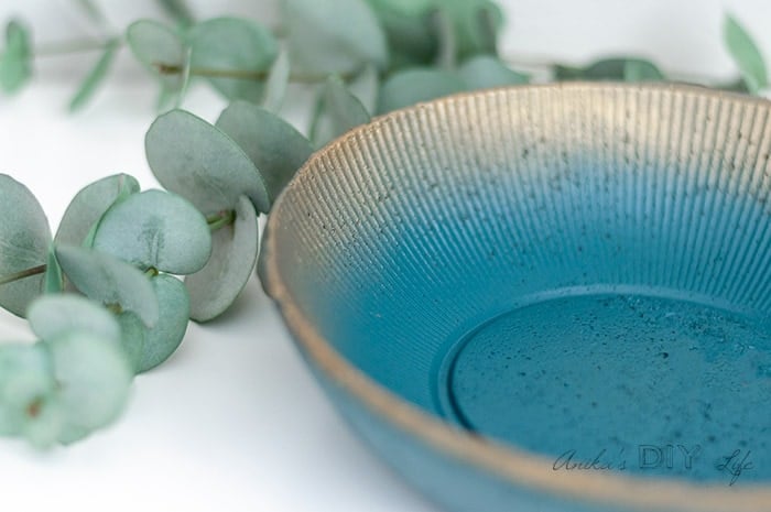 close up of concrete planter with green and gold ombre