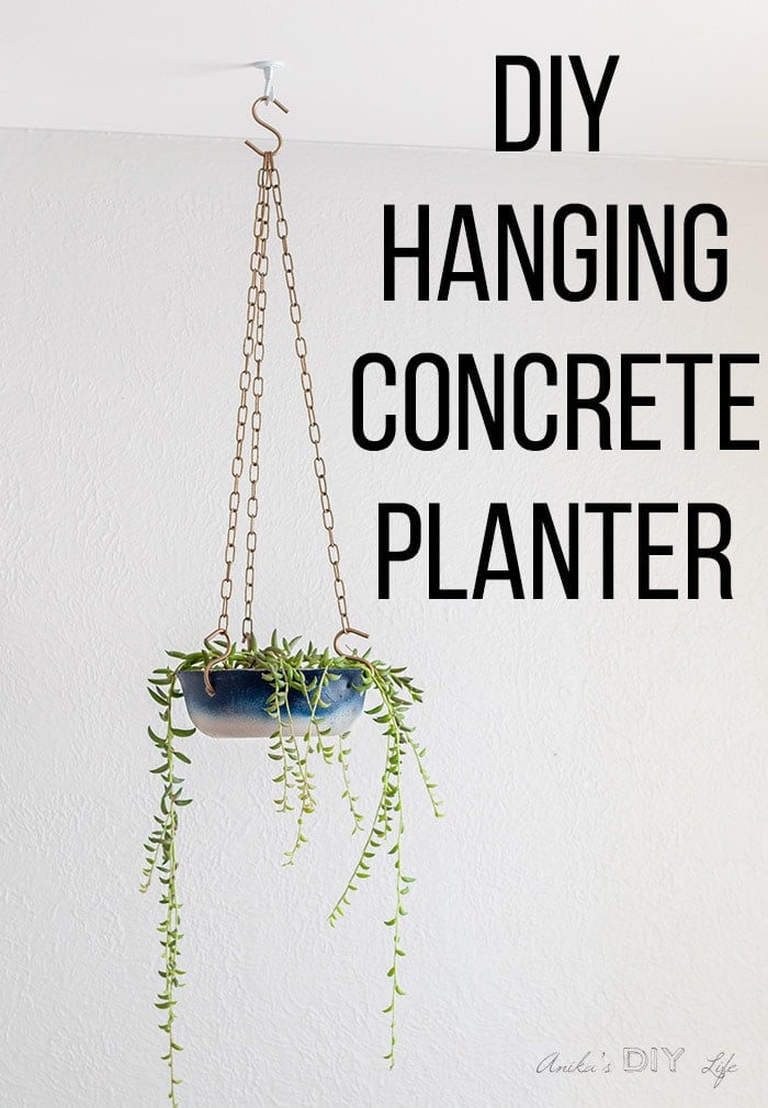 A hanging concrete planter with Ombre paint hanging from the ceiling with text overlay