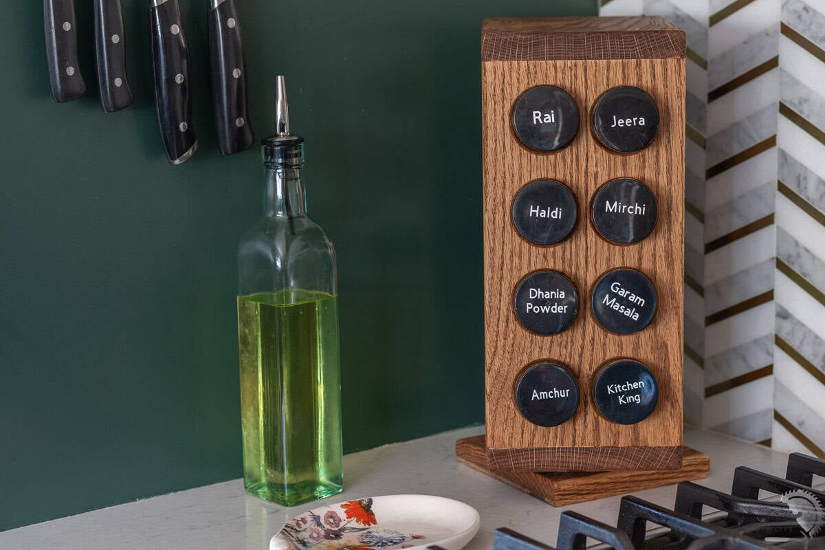 Wooden DIY Rotating Spice rack with spices on a kitchen counter