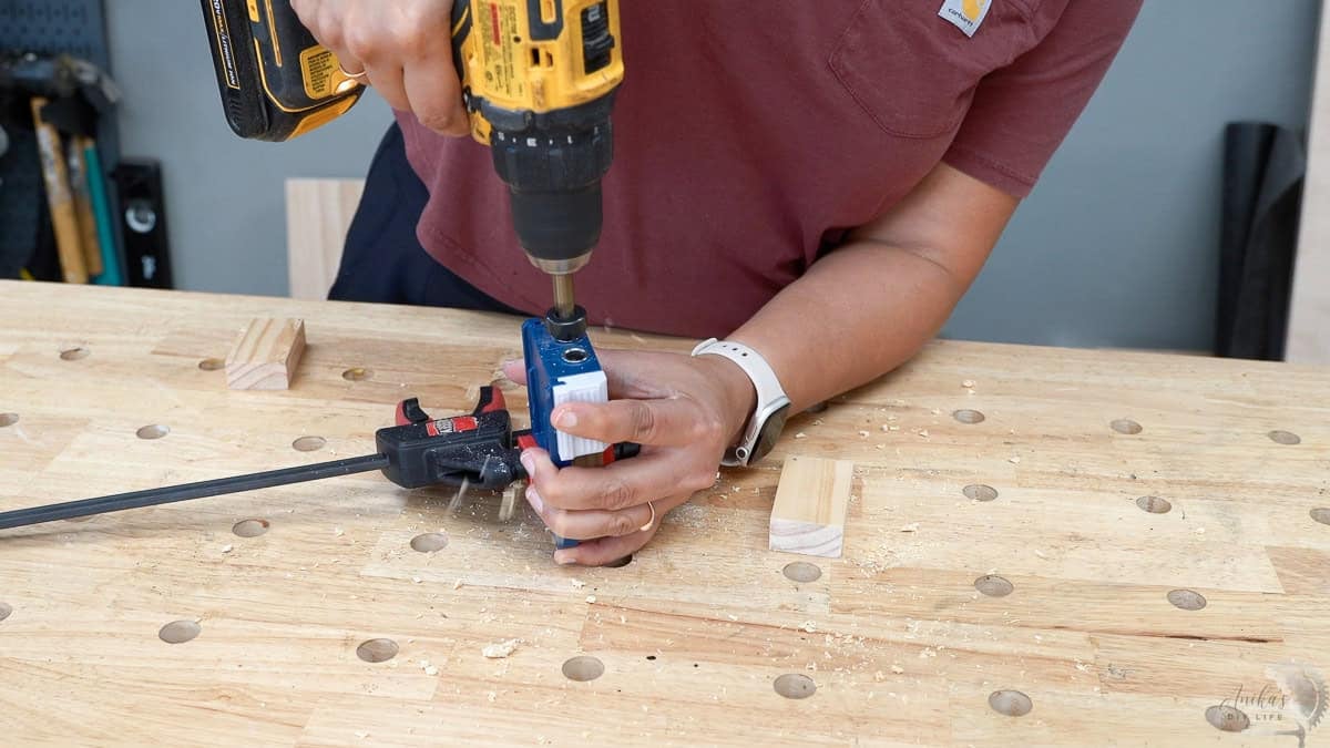 Making dowel holes in the boards to build a diy table top book rack