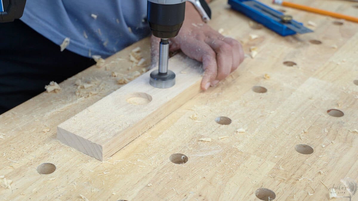 Making spaces for the rings and earrings in the base of the jewelry holder