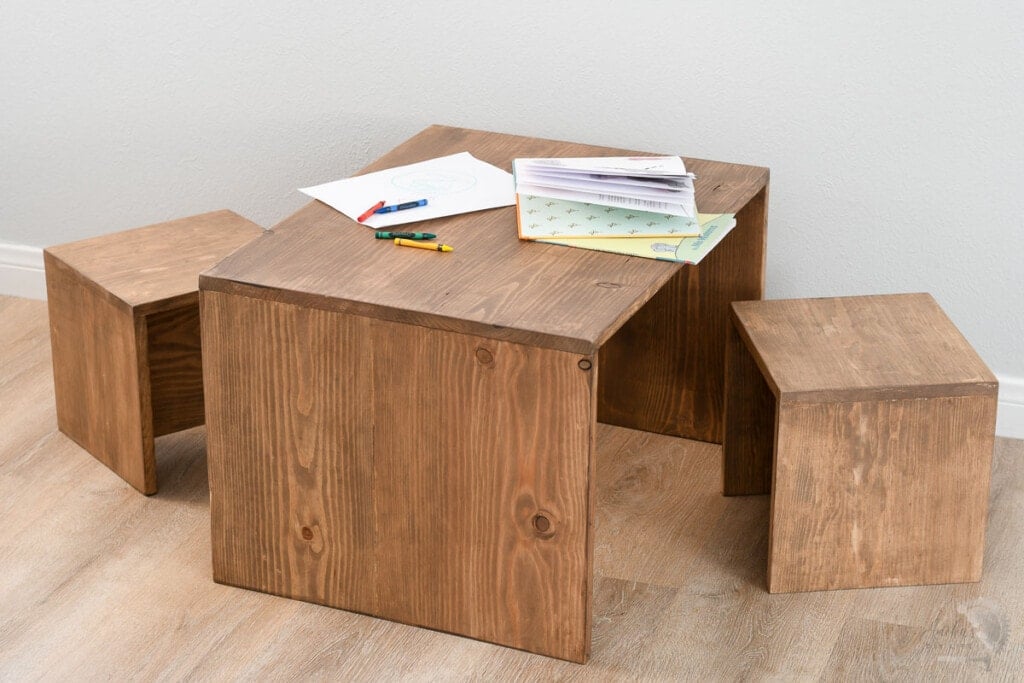 simple toddler table and chair set with books on it