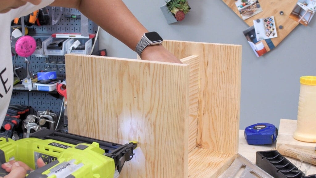 woman attaching seat to montessori style cube chair