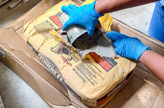taking out concrete from the bag