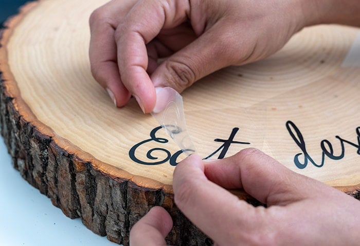 peeling off vinyl on customized DIY wood cake stand