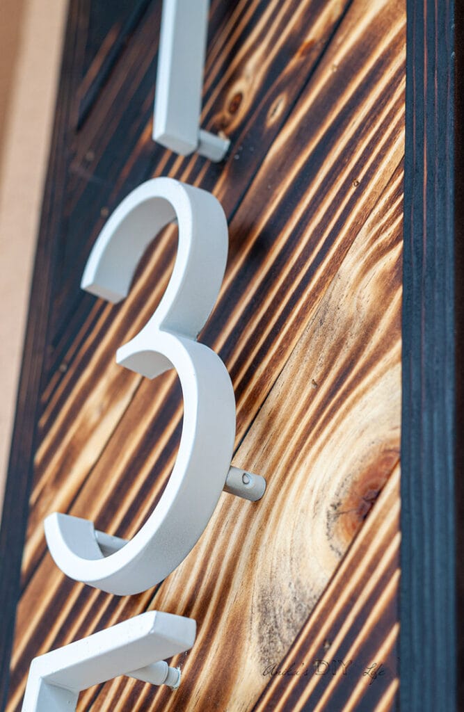 close up of DIY house number sign