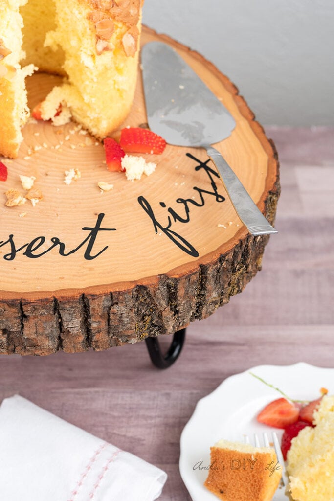 corner of DIY wood slice cake stand with cake