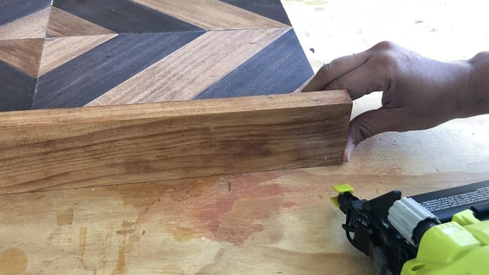 attaching the sides of the tray