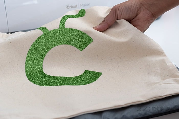 Applying Cricut aplique to linen bag