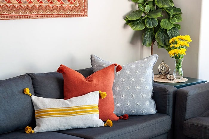 living room couch with colorful pillows