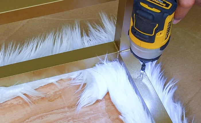 Attaching upholstered top to metal bench