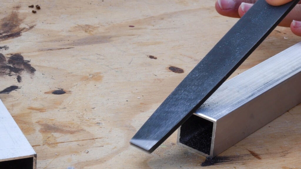 Making a channel ion the edge of the tube using a metal file.