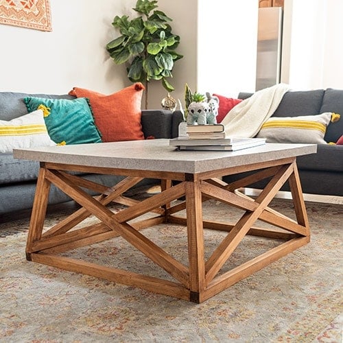 Learn how to build a Serena & Lily inspired DIY square coffee table with angled X-legs. This budget-friendly DIY uses a trick to mimic the concrete top too!