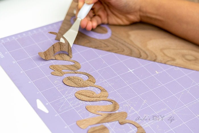 picking up veneer from the sticky mat.