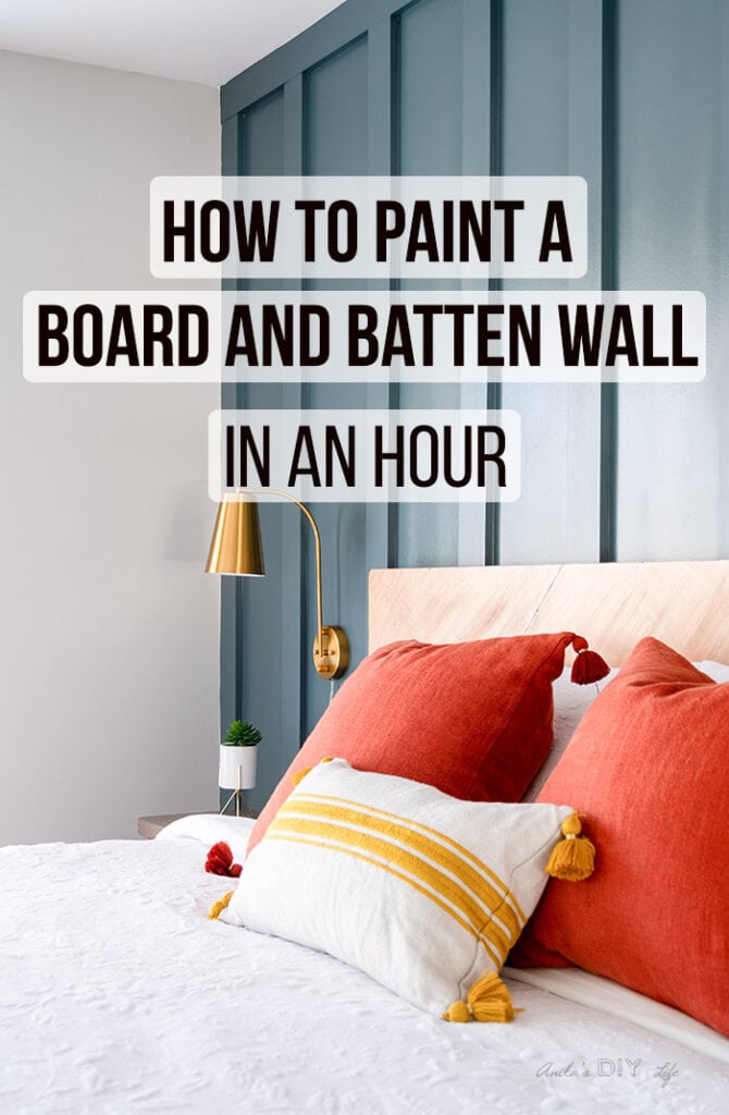 Bedroom with dark green board and batten wall