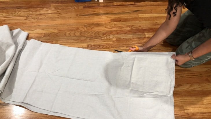 cutting the drop cloth to make the canopy tent
