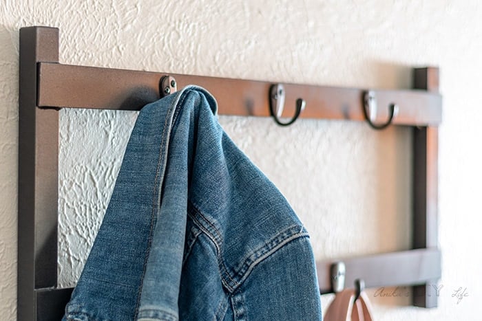 close up of jacket hanging on a DIY metal coat rack