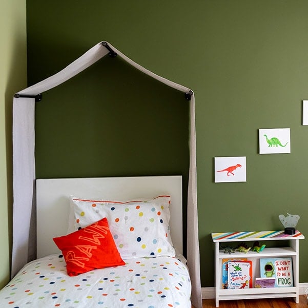 Learn how to make a no-sew canvas DIY canopy tent for over the bed with this quick tutorial. Perfect for any nature-themed or little boy's room or playroom.