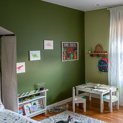 See how I transformed a bedroom into a dinosaur themed room for my toddler boy with simple and easy updates and decor ideas. Hint - it's all in the wall color!