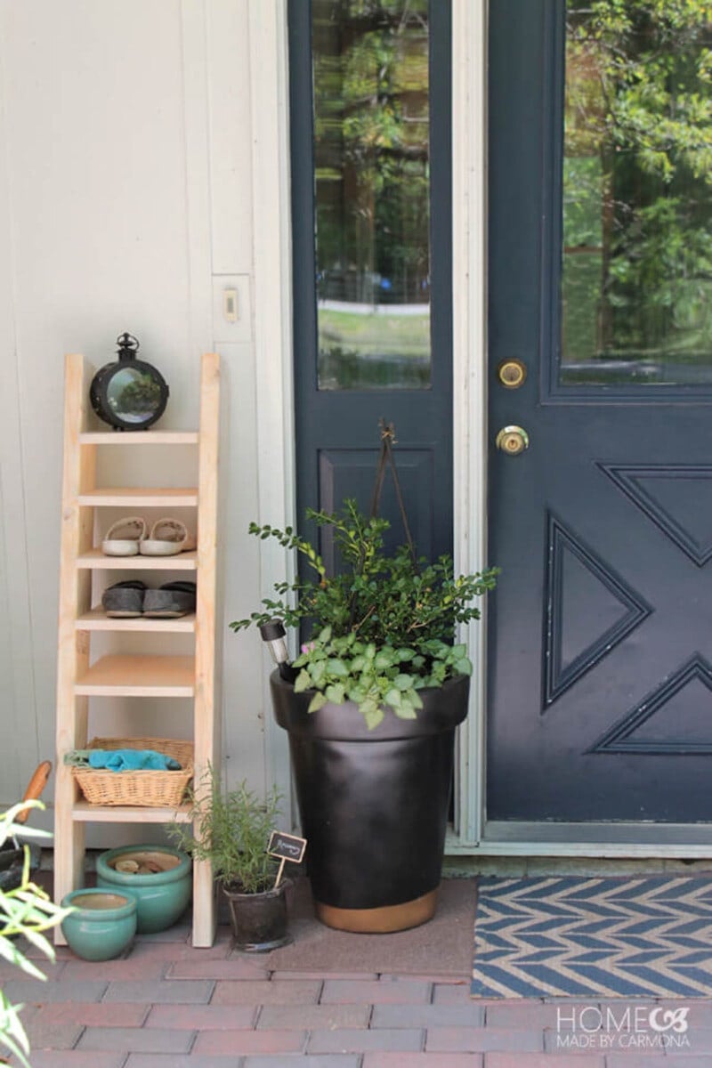 DIY shoe organizing ideas outside on porch using DIY ladder shoe shelf
