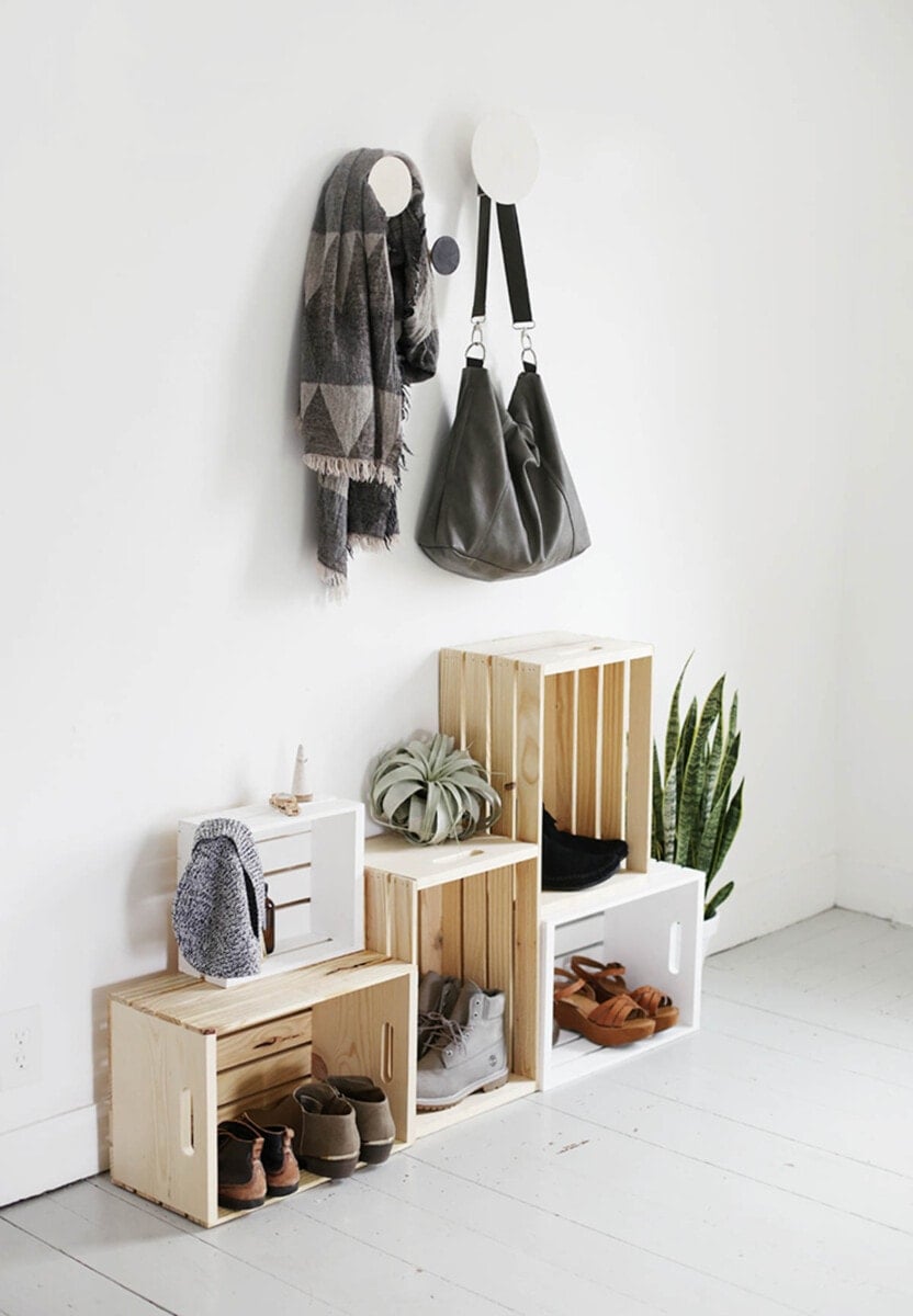 crates of different heights stacked to create DIY shoe organization