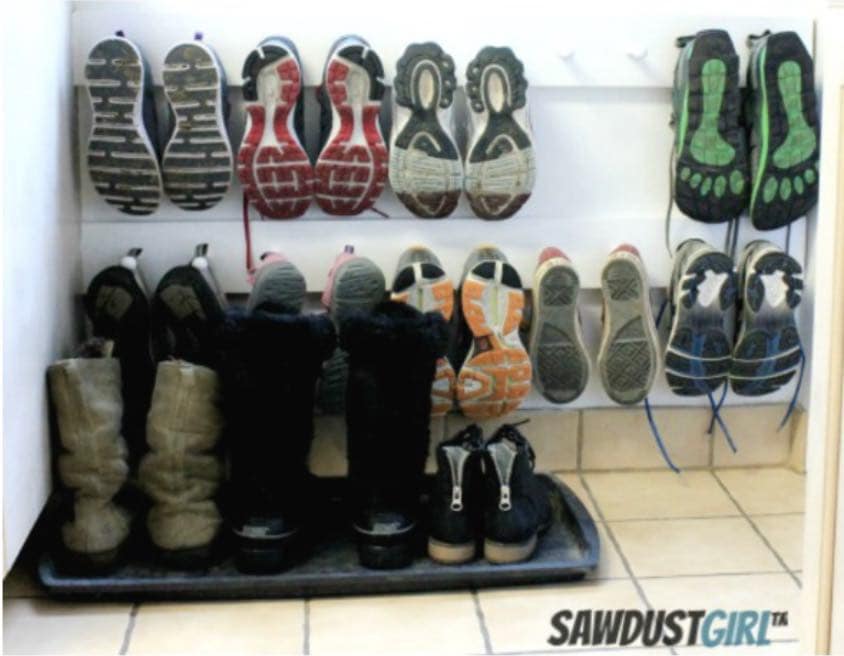 Shoes organized on a DIY peg wall mounted rack
