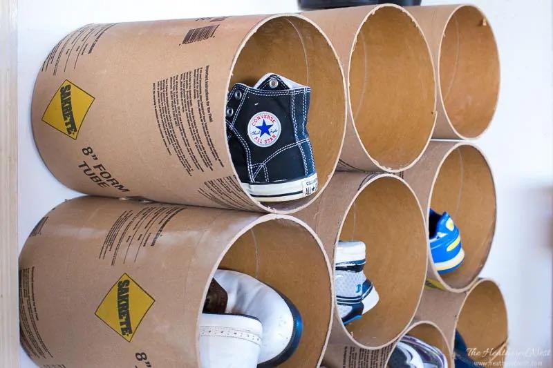 Round concrete forms stacked on top of each other for DIY shoe organization