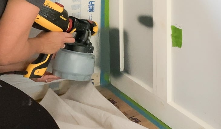 painting a board and batten wall using a paint sprayer